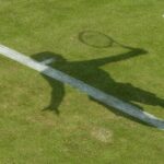 The shadow of a Wimbledon tennis player