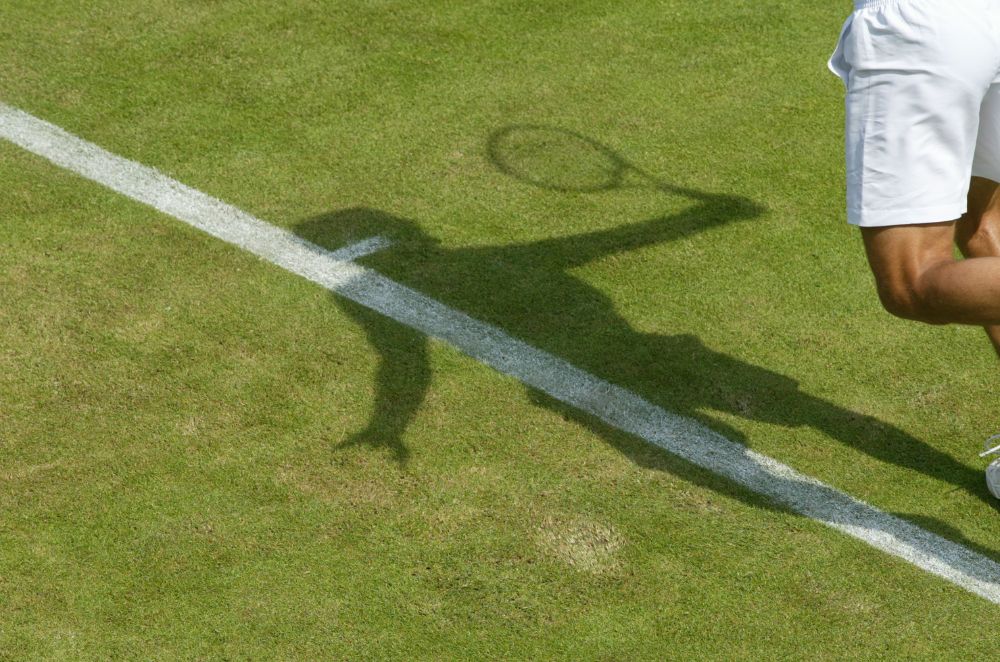 The shadow of a Wimbledon tennis player