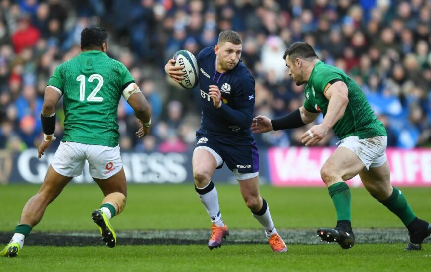 3 rugby players in Murrayfield stadium