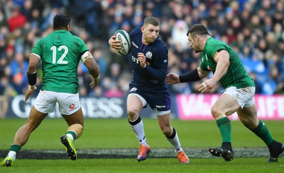 3 rugby players in Murrayfield stadium