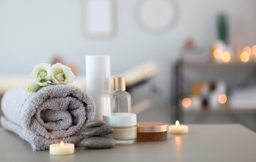 candles and a towel in a spa